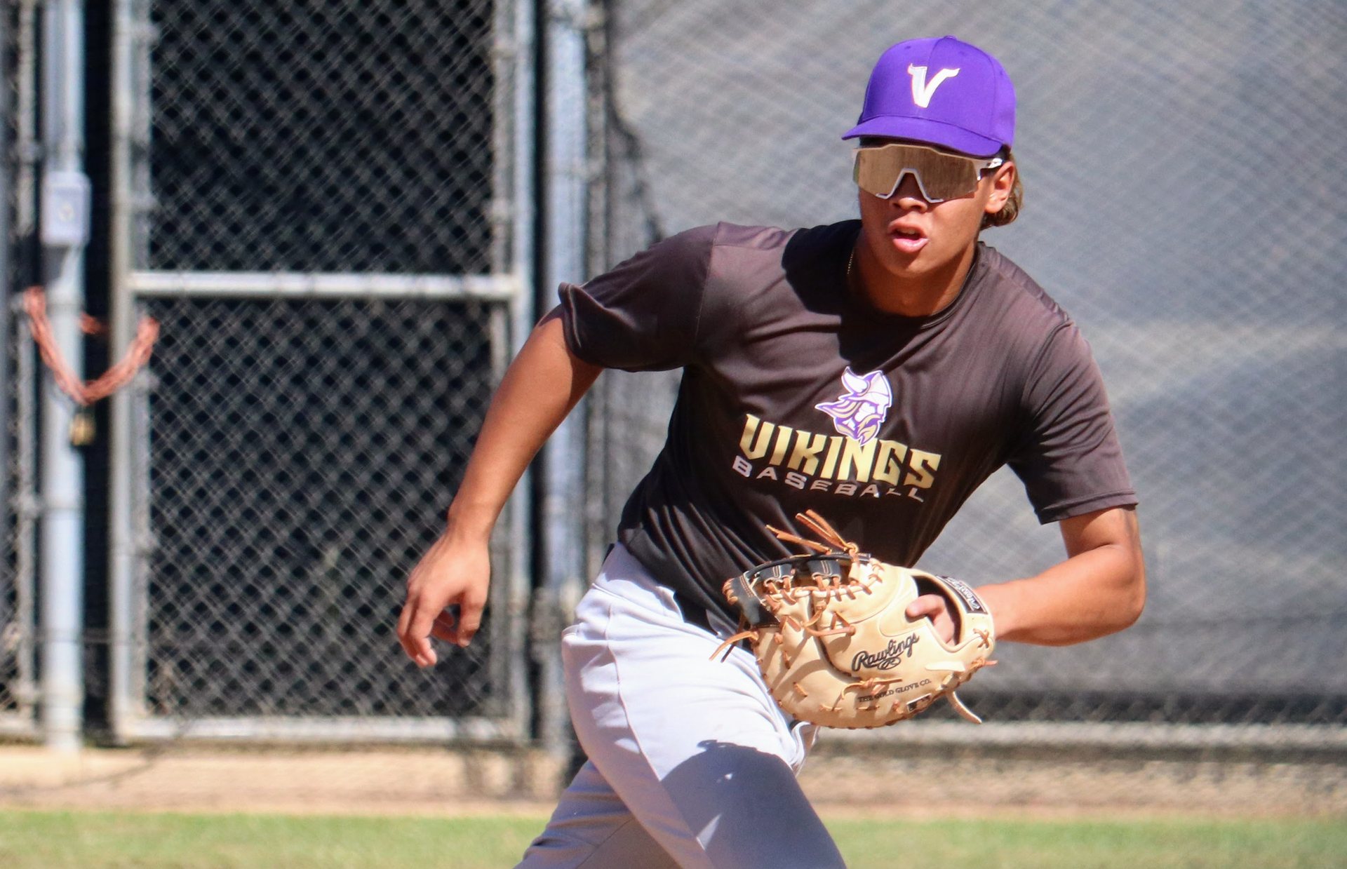 Ryan Nguyen moving to field a ball at first base for Valencia.
