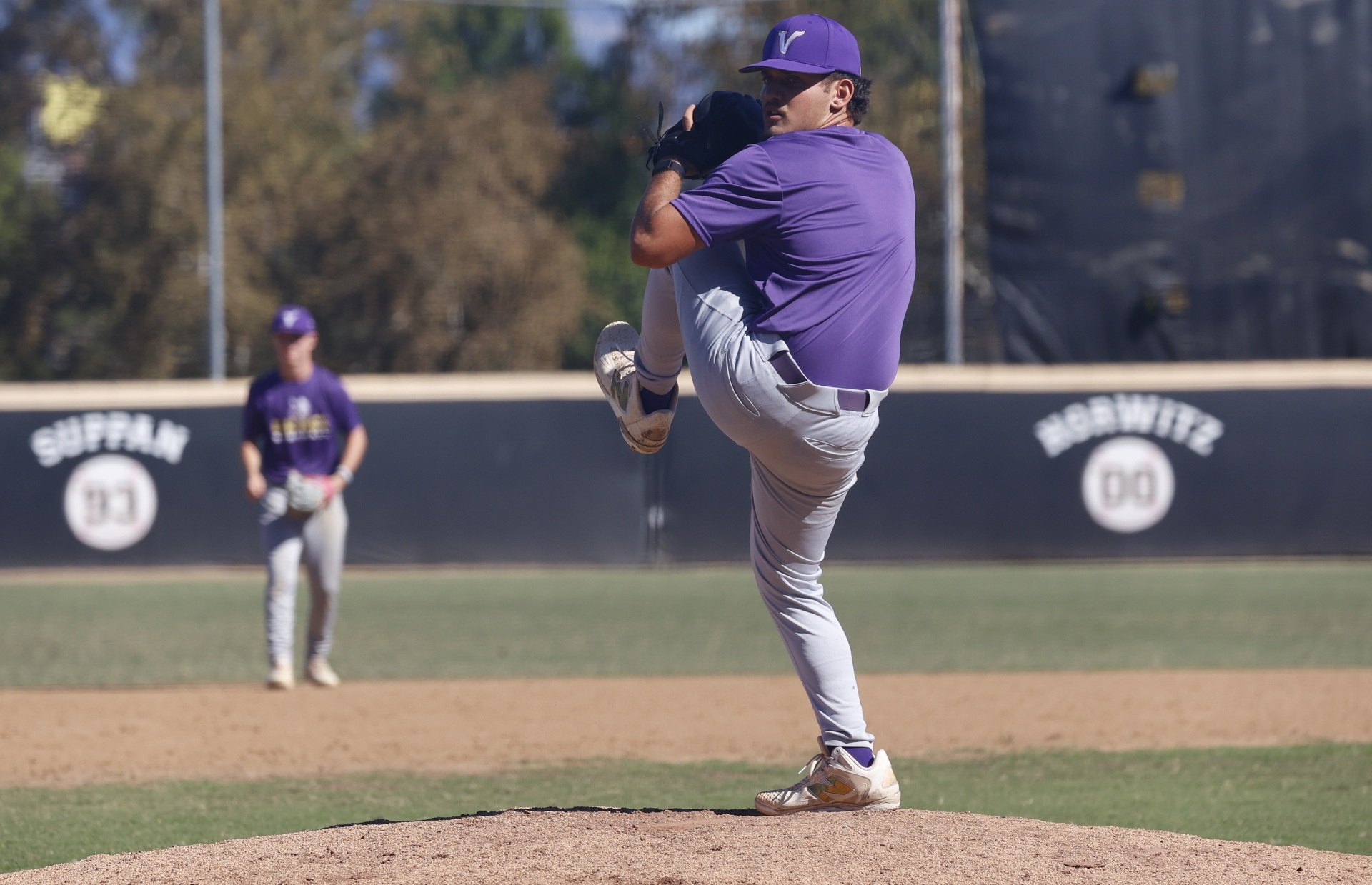 Charles Goodman at the top of his leg kick on the mound for Valencia.
