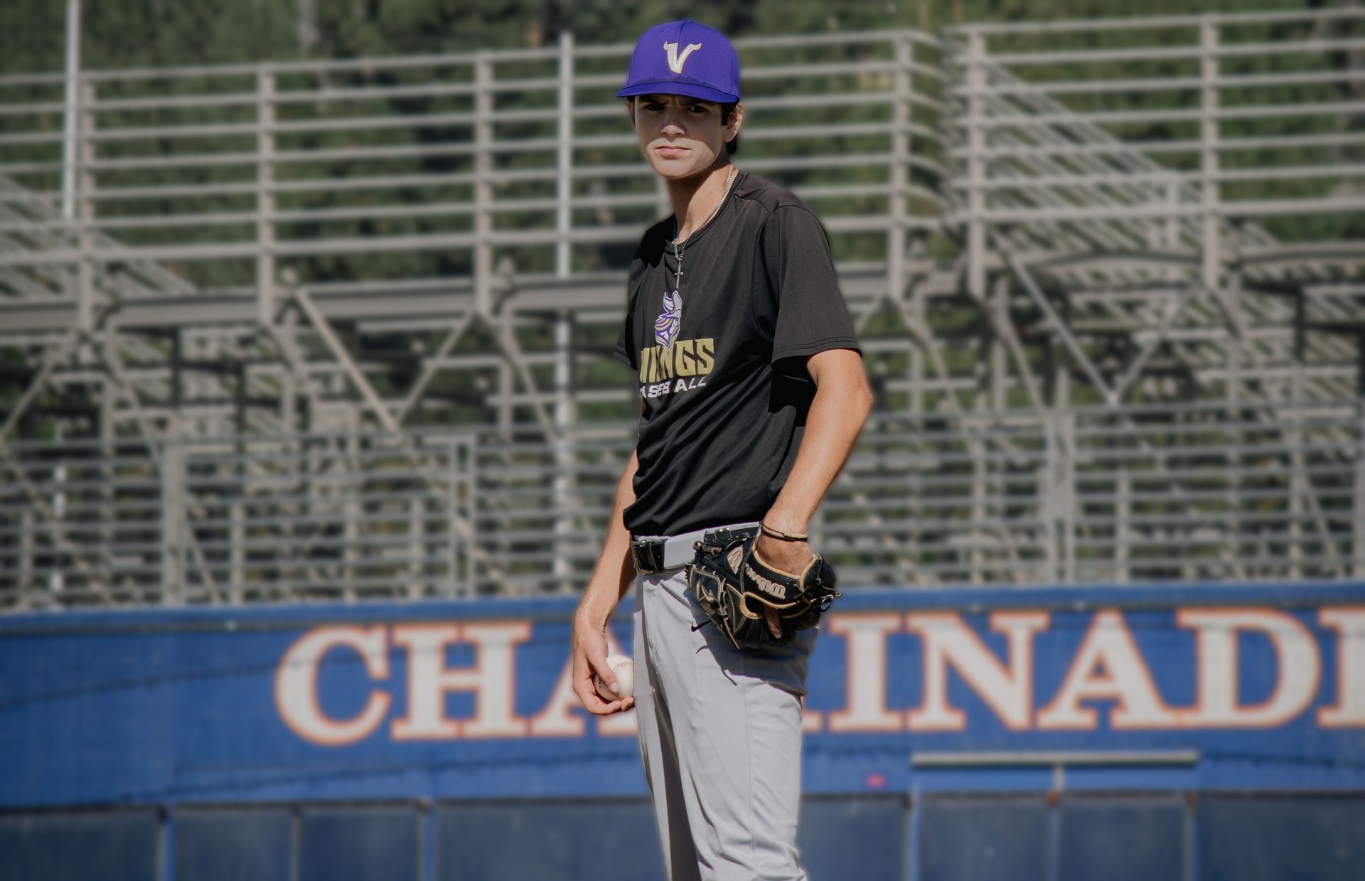 Braden Cianci standing on the infield for Valencia, ball in his throwing hand and his glove resting on his hip.