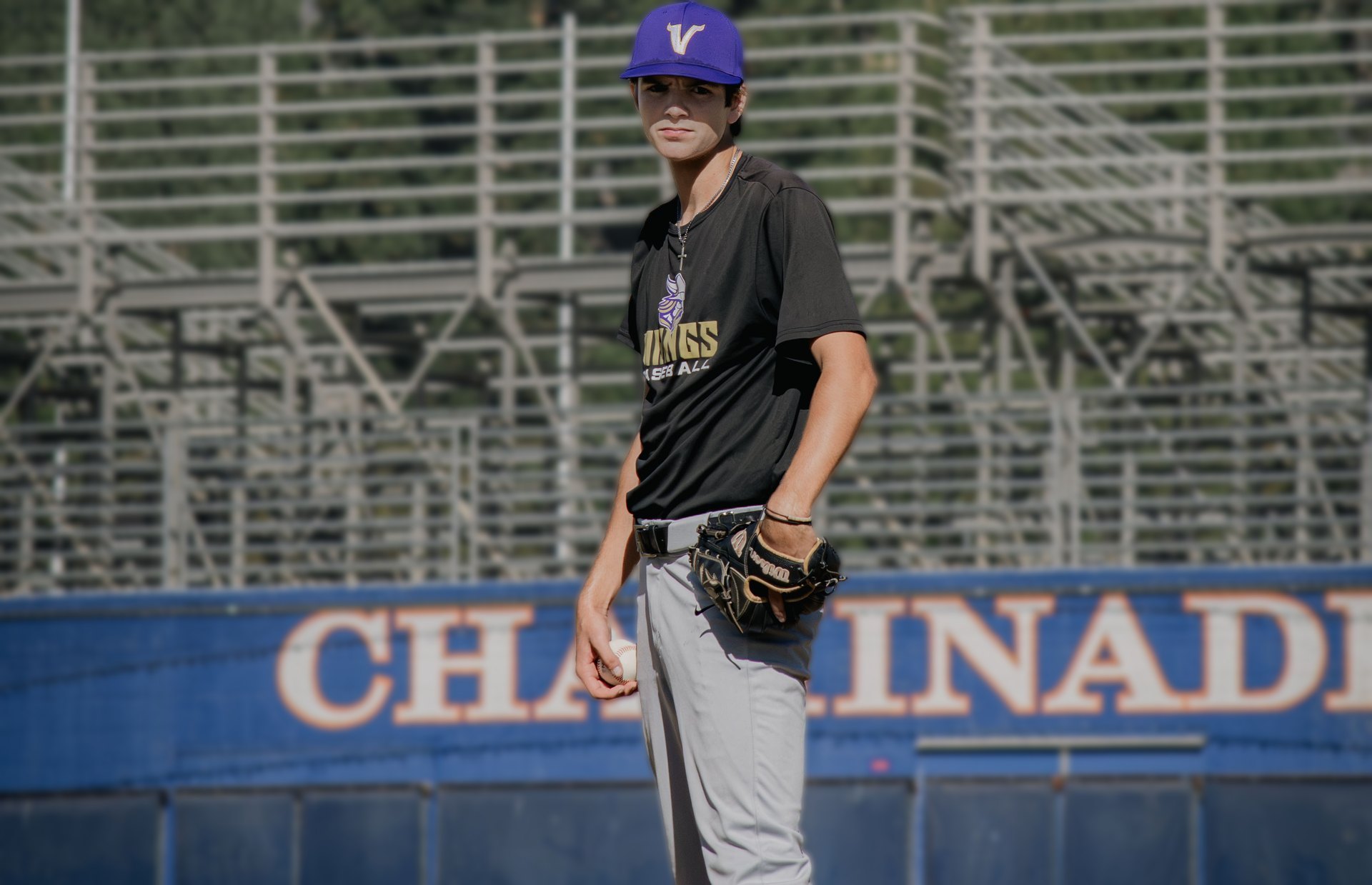 Braden Cianci standing on the infield for Valencia, ball in his throwing hand and his glove resting on his hip.