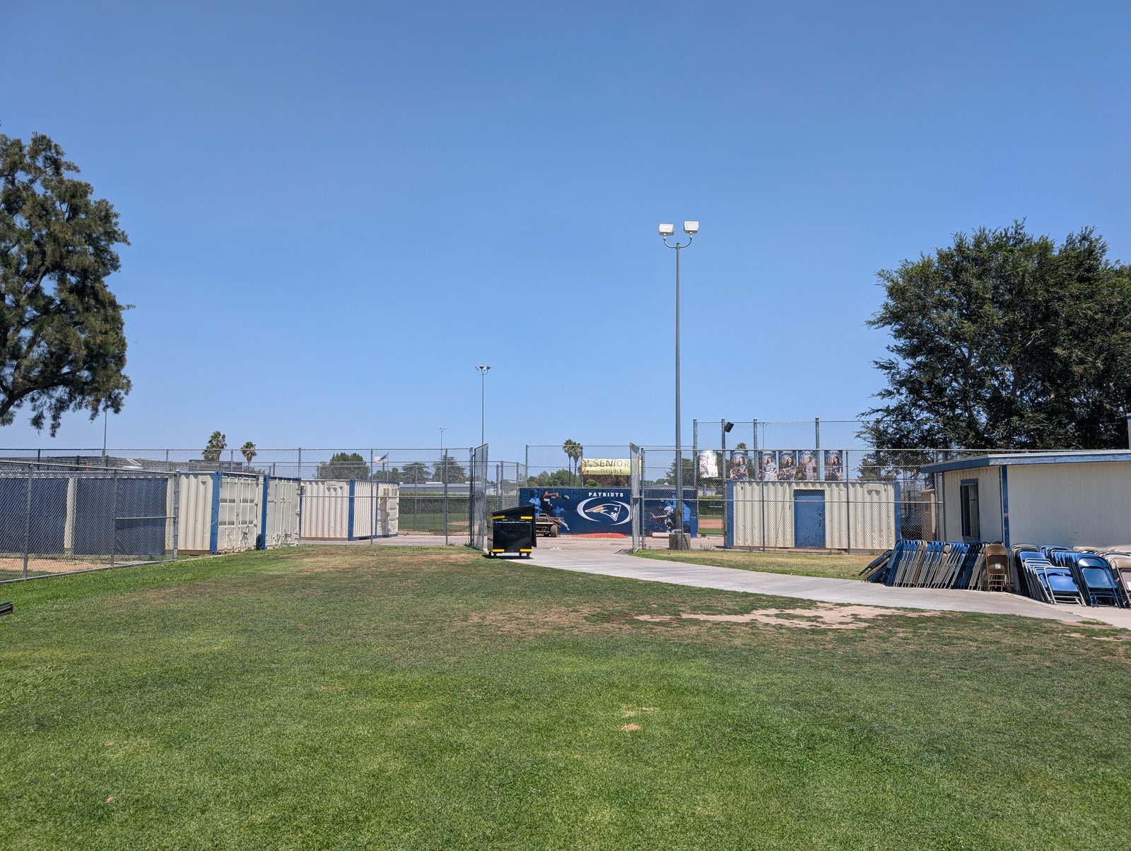 Field entry gate and the program's storage containers near right-center.