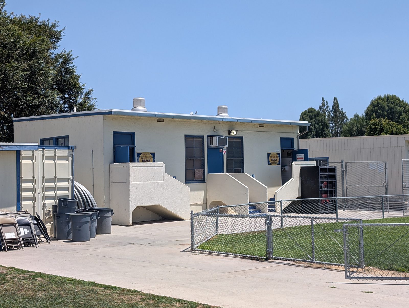 The permanent restroom building just outside right field. Real bathrooms, not portables.