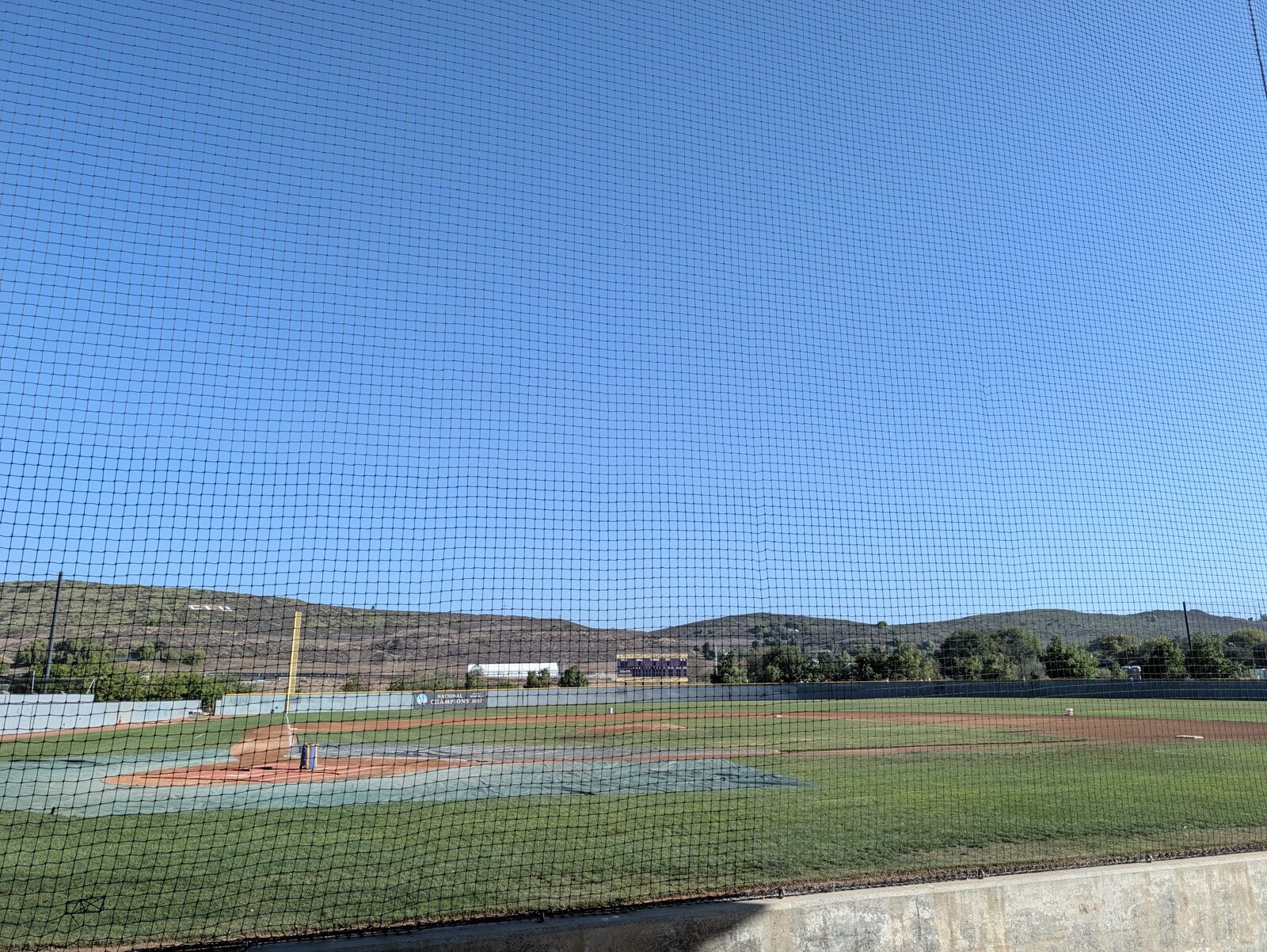 The height of the protective netting, the foul pole, and the National Champions 2017 banner.