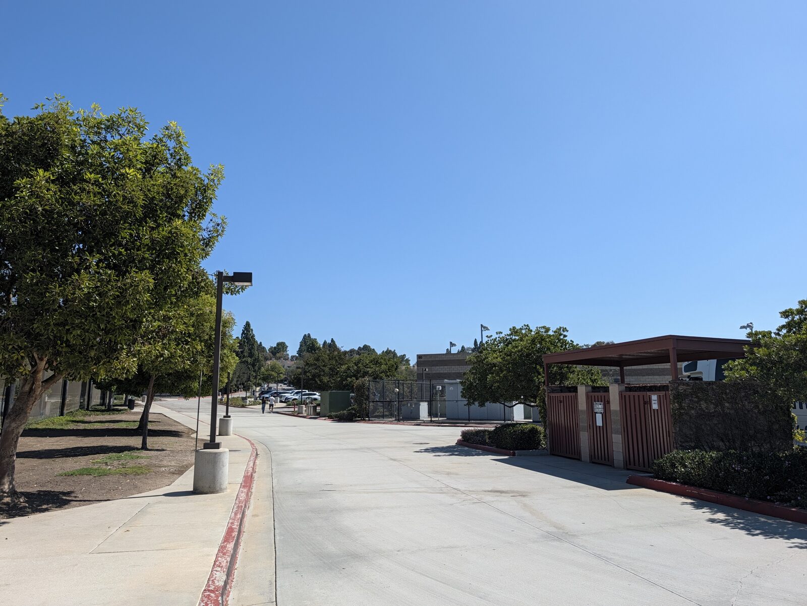 Looking back from the stadium to the parking lot. That is the whole walk: flat, paved, one to two minutes.