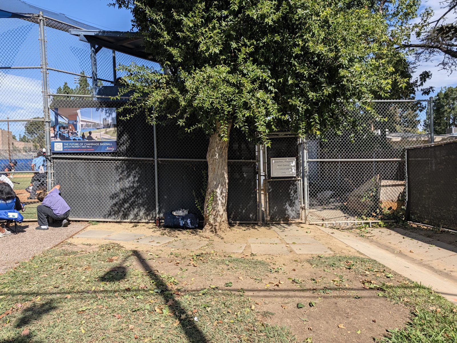 Behind home plate.