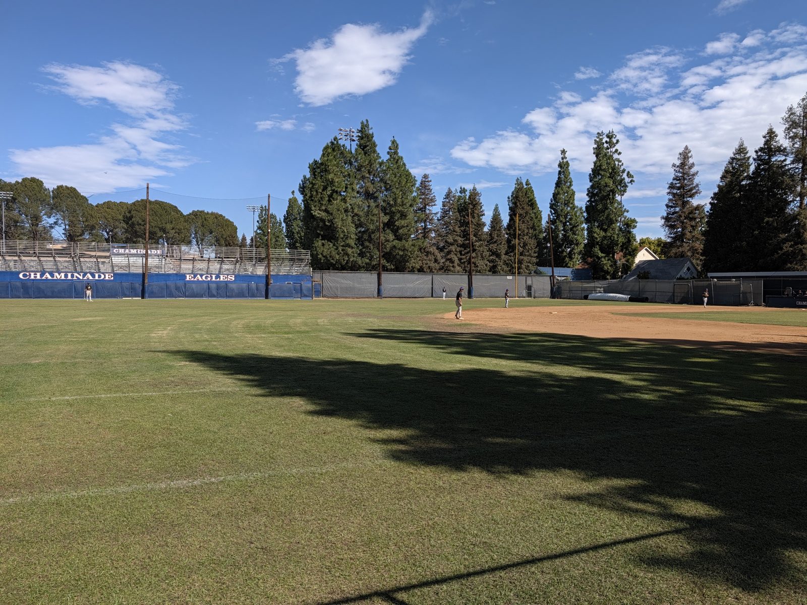 The outfield, with the net across the top of the wooden posts.