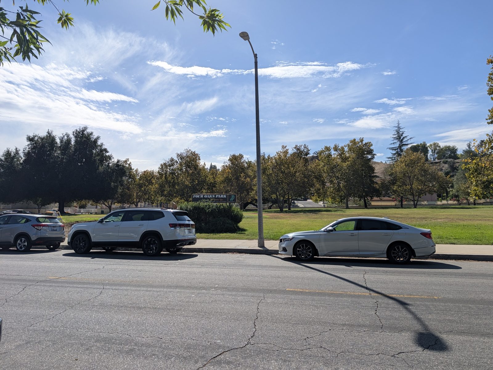Open street parking along Four Oaks Park, next to the field. Probably park at your own risk with foul balls.