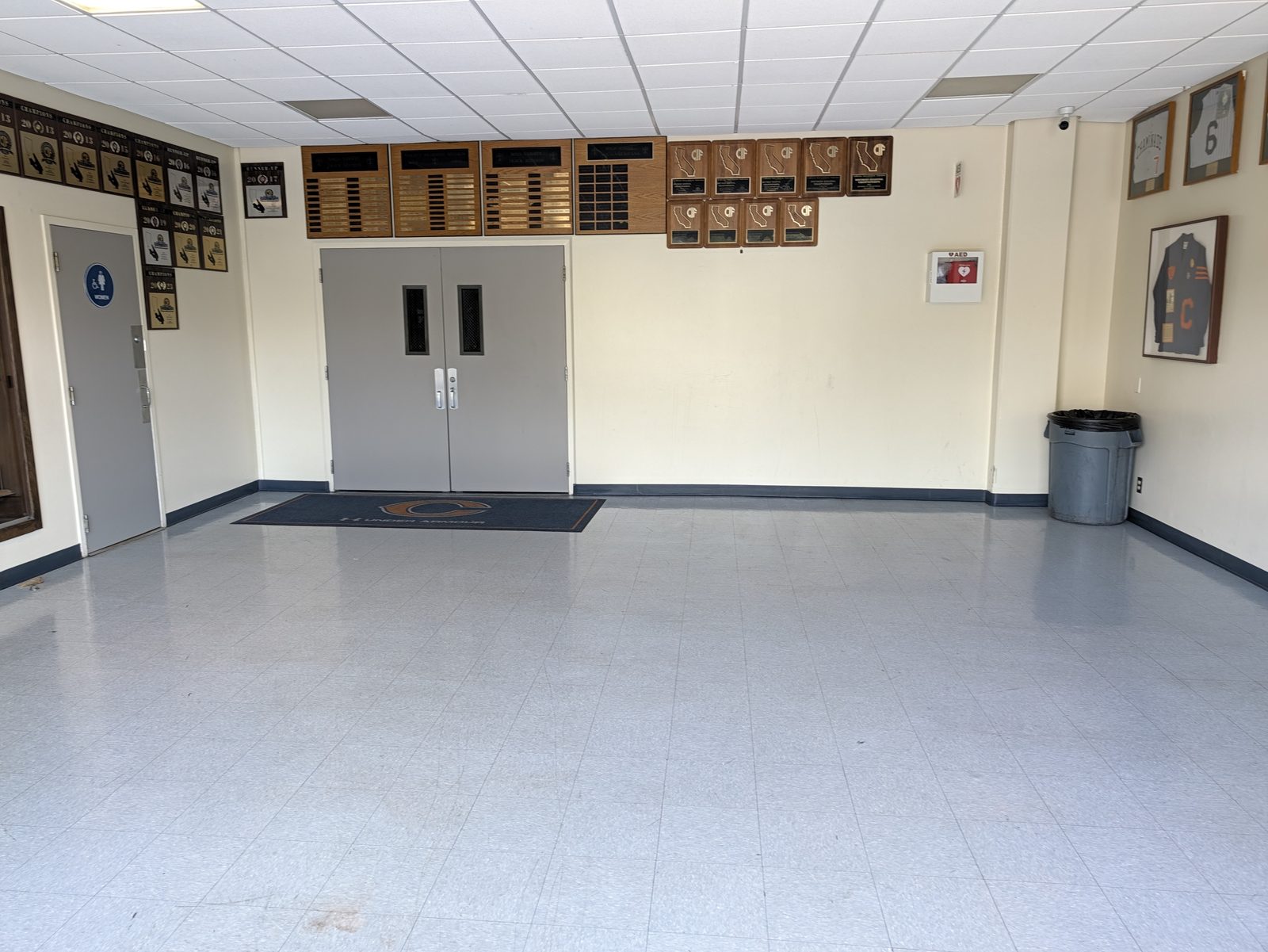 Inside the Uribe Sports Center, where the restrooms are.