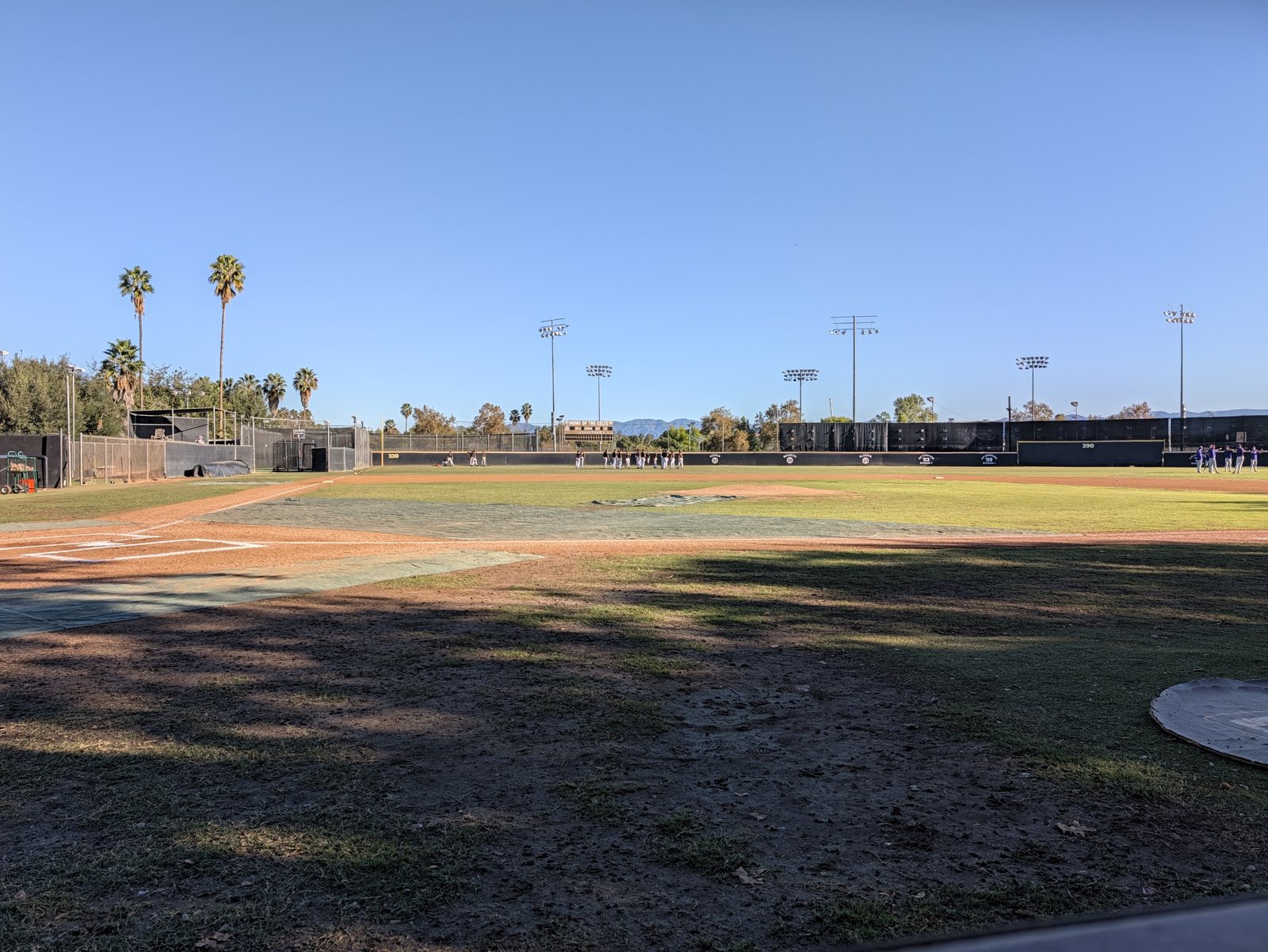 The field end to end, with the scoreboard beyond center.
