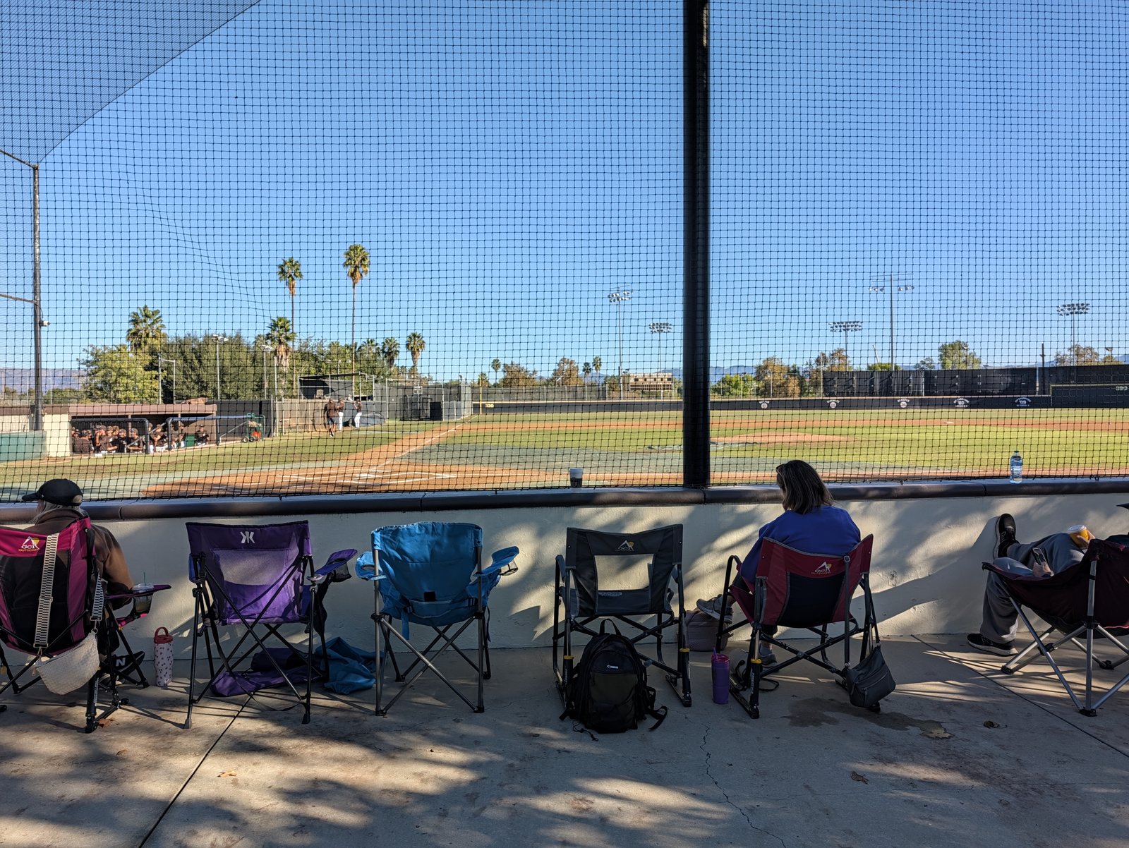 Your own chair, right up against the fence behind home plate.