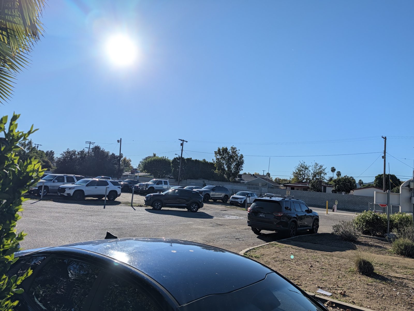 The parking closest to the field, by the roundabout with the flagpole.